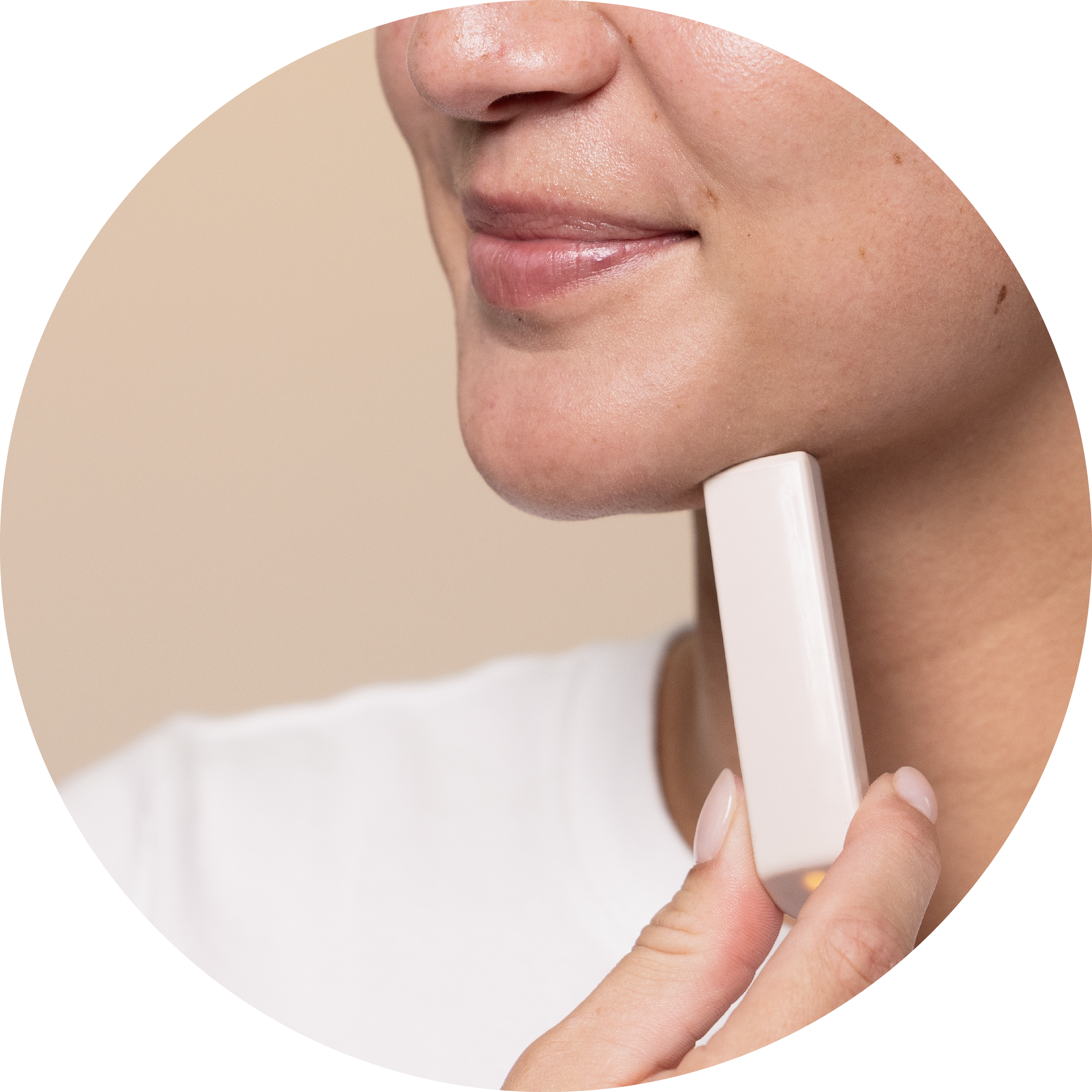 a female model using the wand of the boldhue device to scan her chin